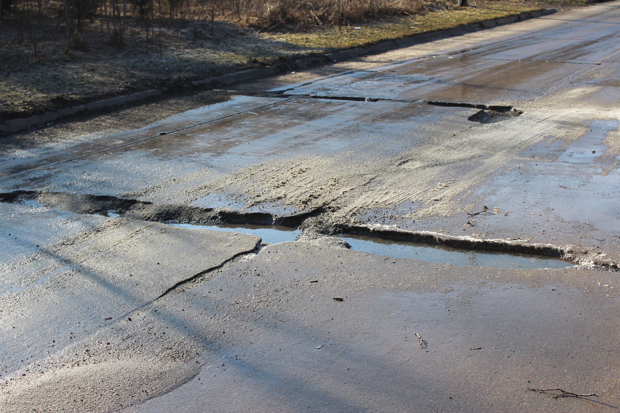 Houser Street has plenty of potholes to fill (JPG)