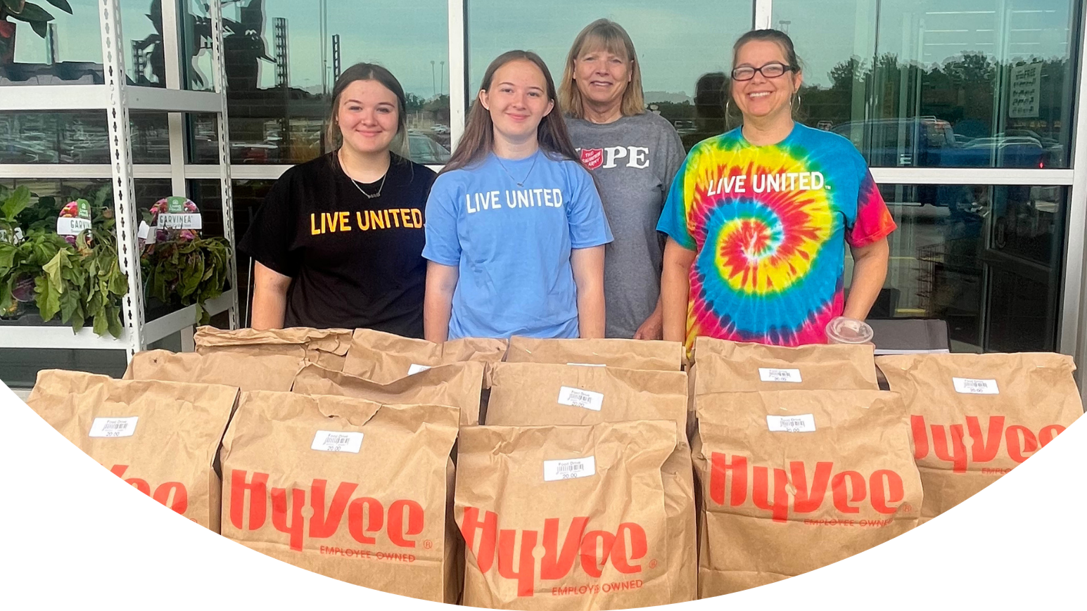 Thanksgiving in July 2025 Promo (JPG) bags of groceries and individuals 