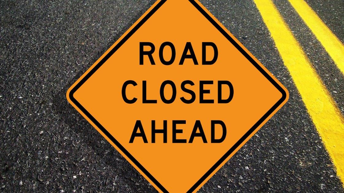 Road Closed Ahead (JPG) sign with roadway in background