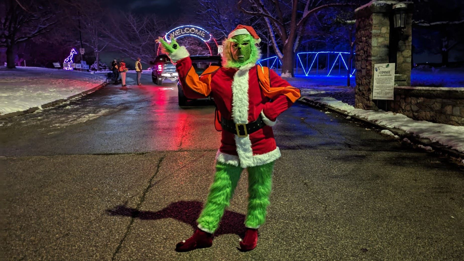 Welcome Grinch (JPG) to Weed Park entrance with holiday lights in background